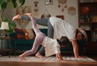 Mother and her small daughter practicing yoga in the living room at home 2040536011 1369x770