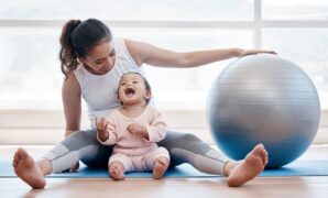Shot of a young mother exercising with her baby girl at home 1397879227 1311x803