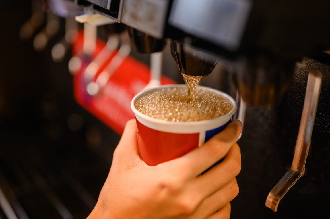 Small Hands at a Soda Machine