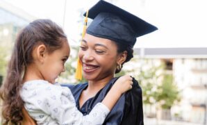 a joyful graduate embraces