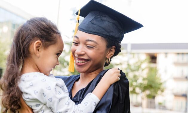 a joyful graduate embraces