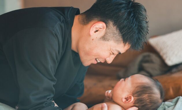 asian father holding a