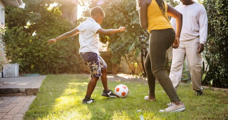 small boy playing soccer