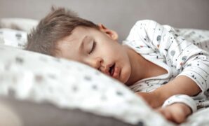 Little blond boy sleeping in his bed. 1223560129 1258x839.jpeg