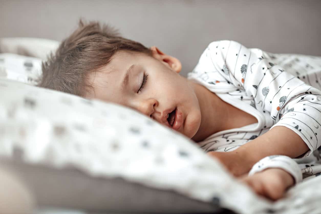 Little blond boy sleeping in his bed. 1223560129 1258x839.jpeg