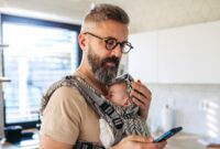 father scrolling on smartphone.jpg