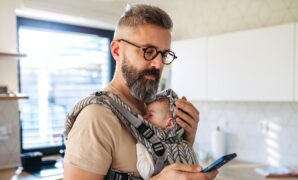 father scrolling on smartphone.jpg