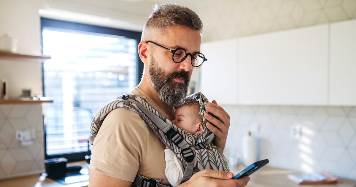 father scrolling on smartphone.jpg