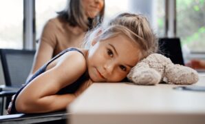 little girl rests head.jpg