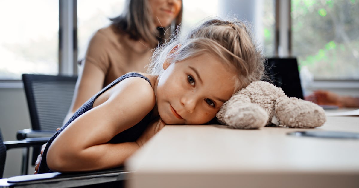 little girl rests head.jpg