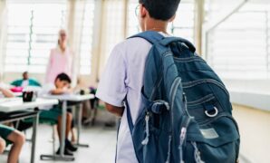 student carrying backpack arriving.jpg
