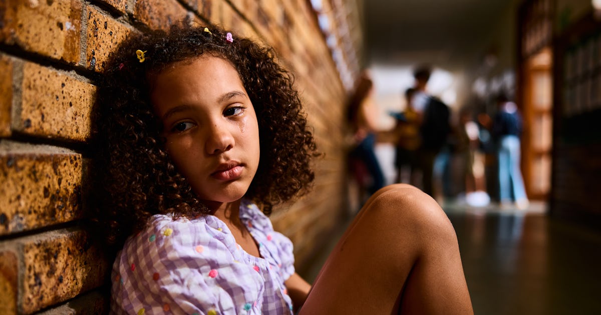 schoolgirl sitting on floor.jpg