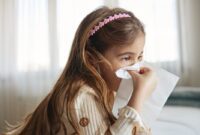 sick girl with tissues.jpg