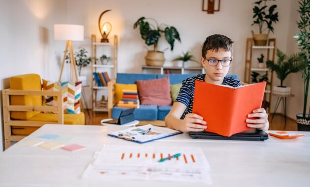 teenager holding book in.jpg