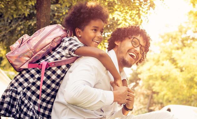 Father and Daughter Smiling Back to School Parent.jpg