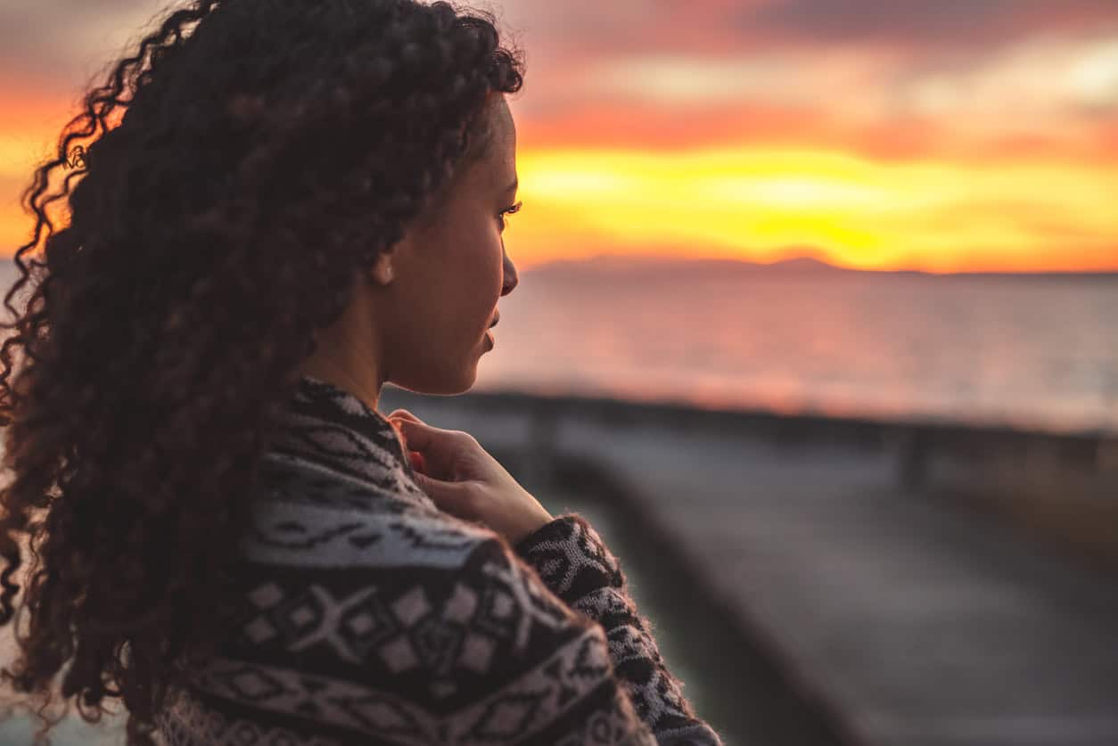 Thoughtful evening mood with a young afro latino woman 1152605834 1256x838.jpeg