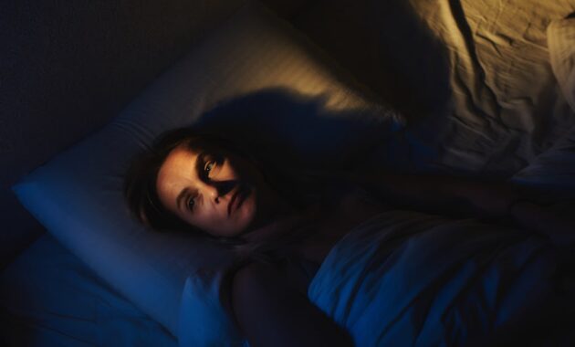 a woman lies awake.jpg