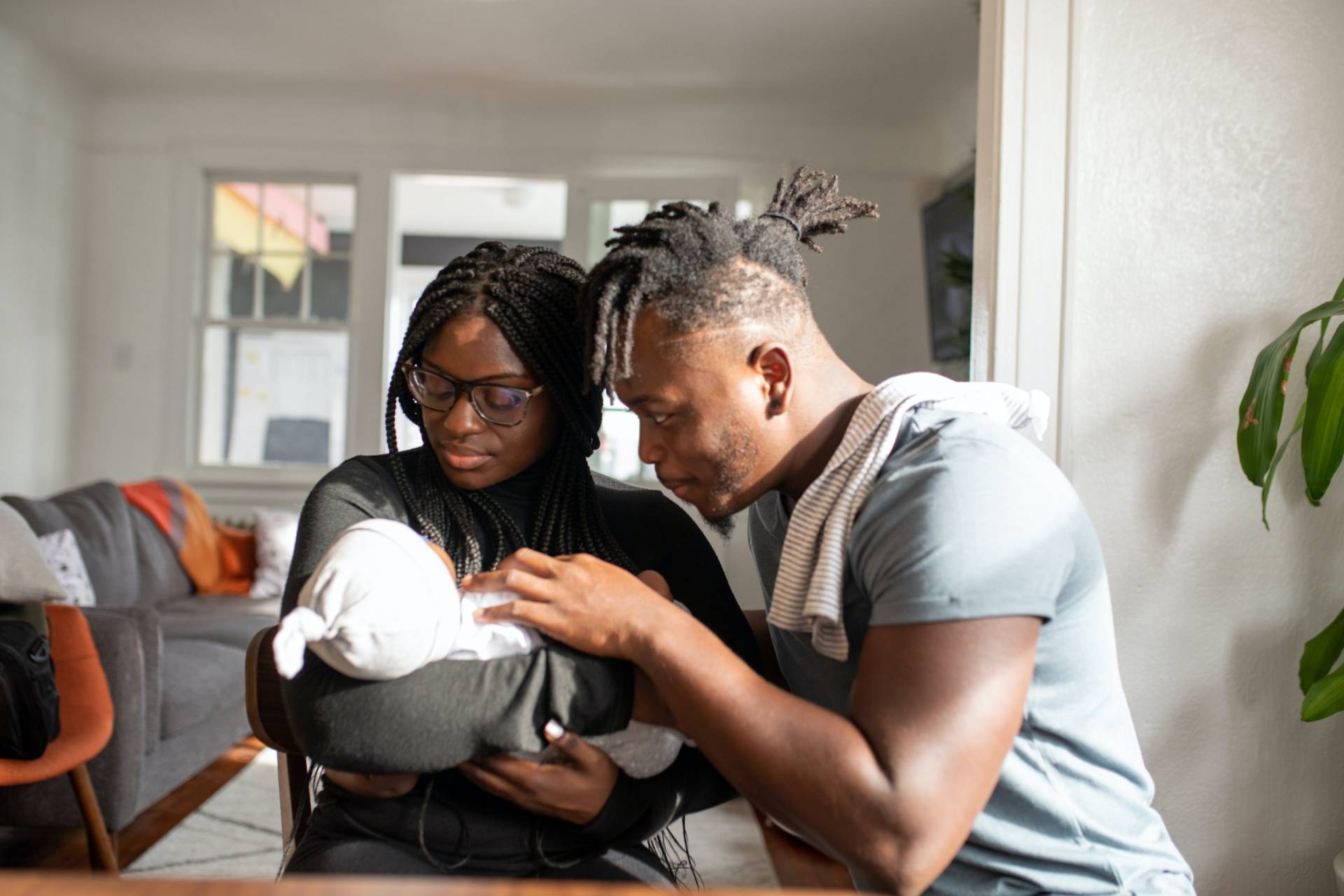 parents looking at their baby 3584088.jpg