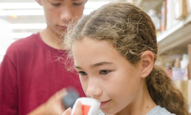 teenager girl smelling a.jpg