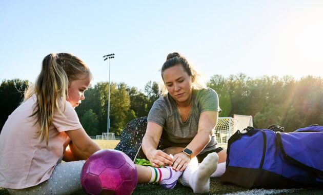 young woman tying shoelaces.jpg