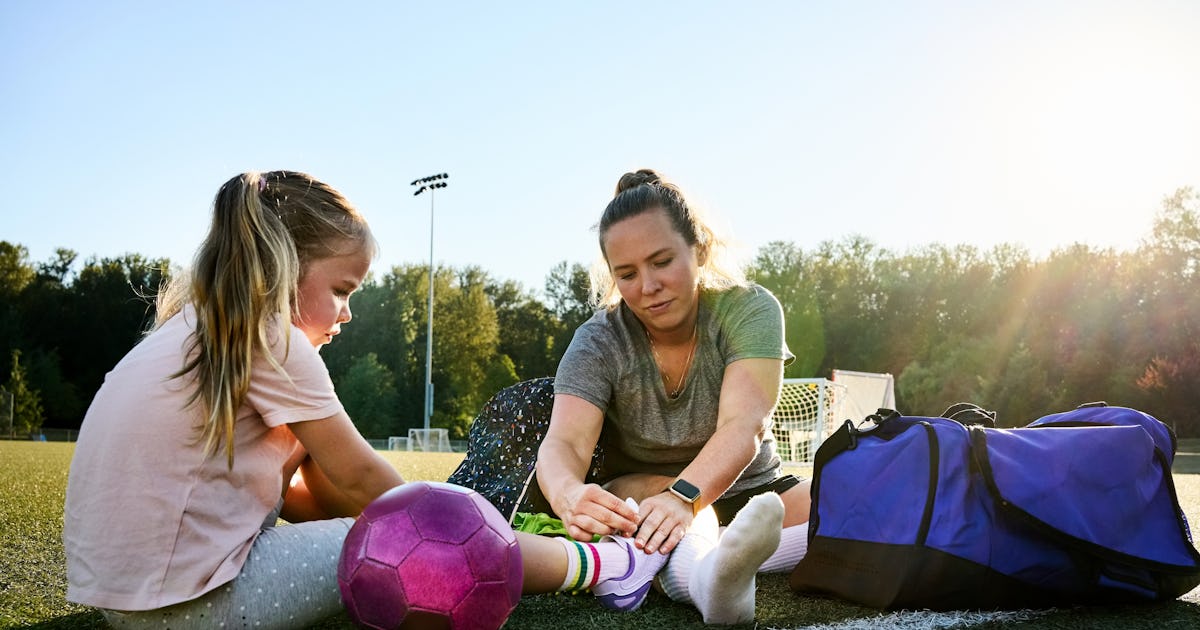 young woman tying shoelaces.jpg