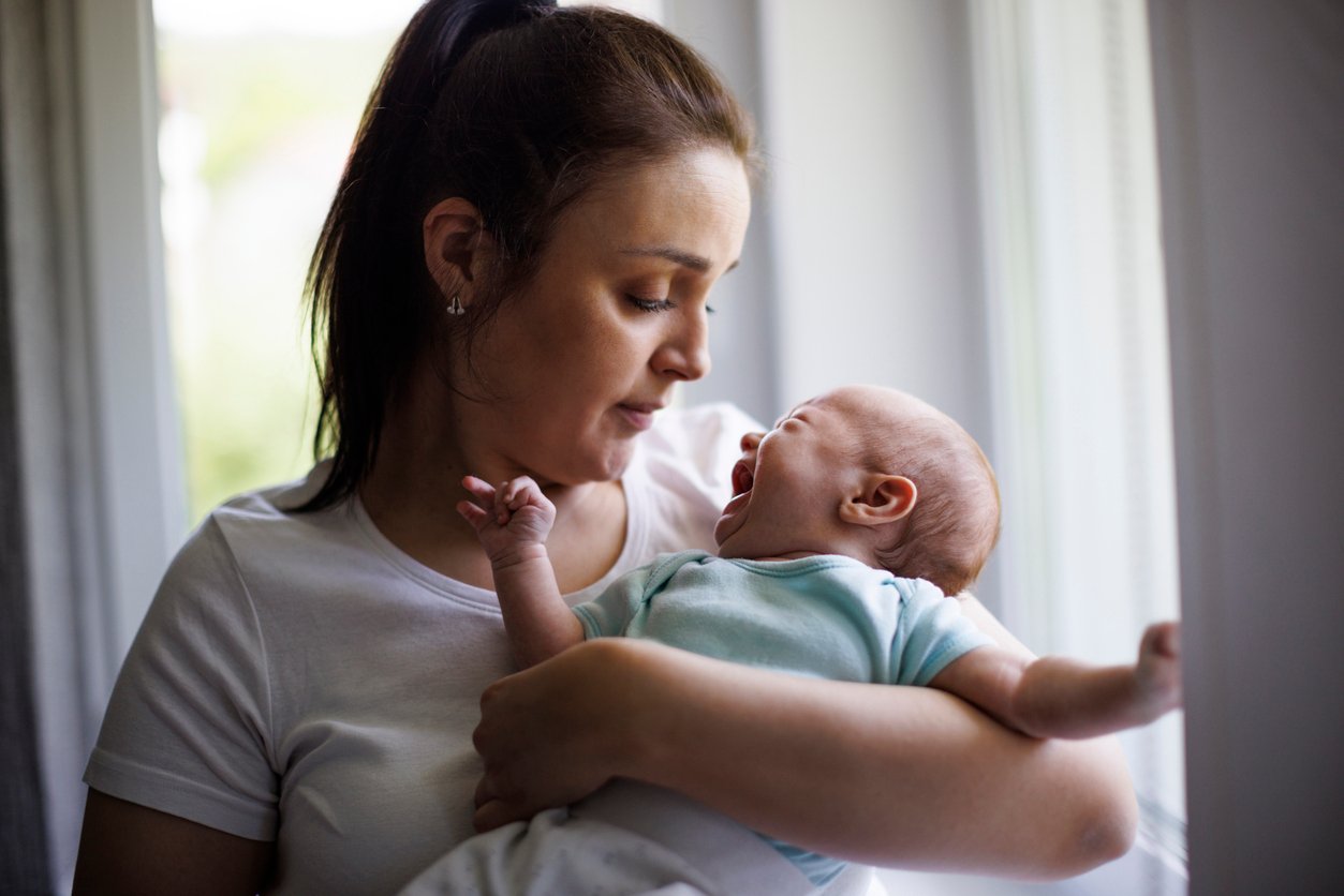 Mother and crying newborn baby 1500858068 1257x838.jpeg