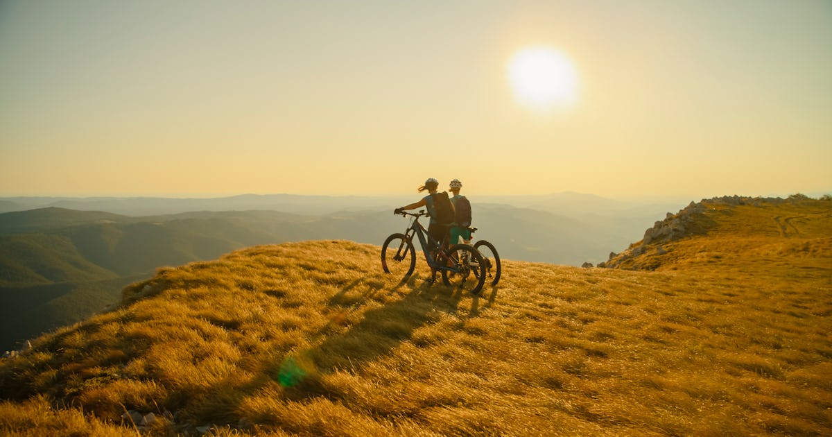 two female cyclists stand.jpg