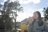 woman smoking vape pen.jpg