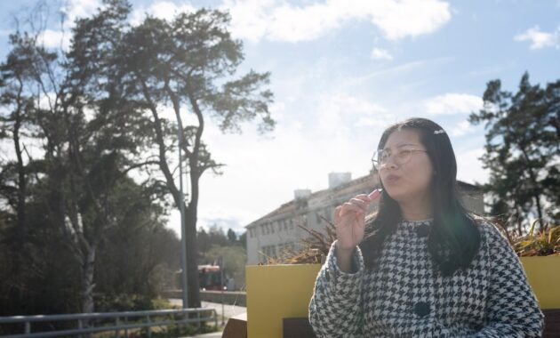 woman smoking vape pen.jpg