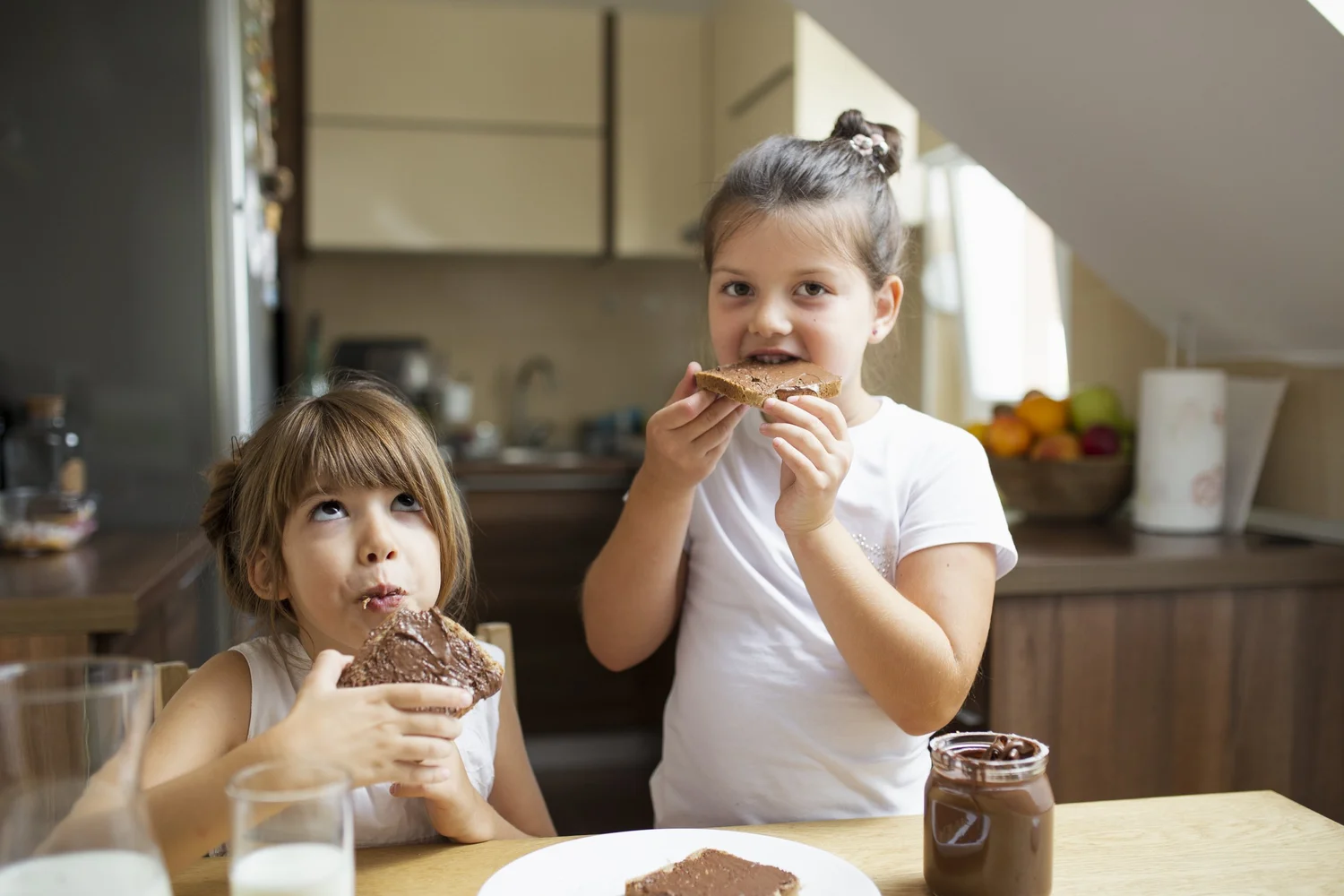 young girls having morning breakfast home.jpg