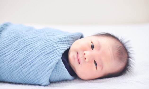 Child is laying in bed with smiling face 1347048597 1258x838.jpeg