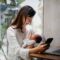 Woman working at home while taking care of her newborn baby 1550818806 2124x1416.jpeg