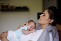 exhausted mother holding her.jpg