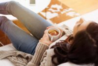 relaxing at home tea lemon woman couch relaxation mindfulness meditation.jpg