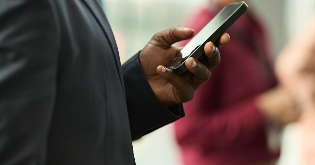 midsection of businessman scrolling.jpg