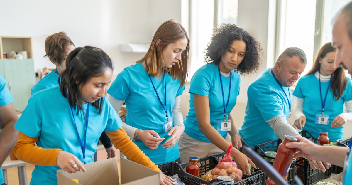 volunteers sorting packing food.jpg