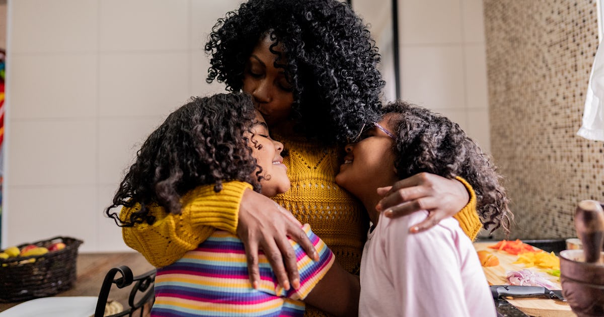 mother daughters embracing in.jpg
