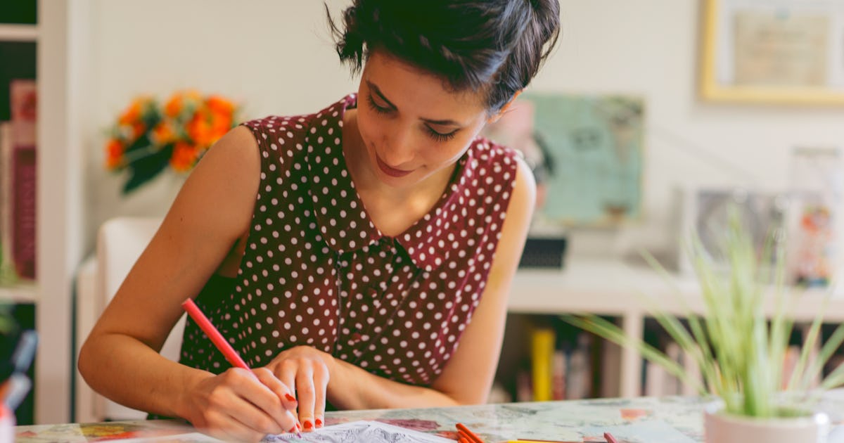 young smiling woman coloring.jpg