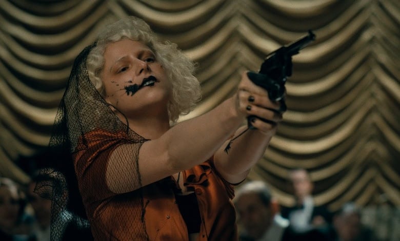 The Bride review Jessie Buckley with gun 3.jpg