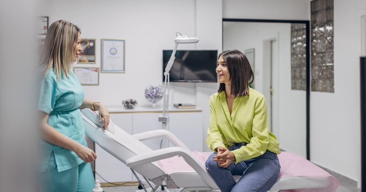 female cosmetologist with talking.jpg