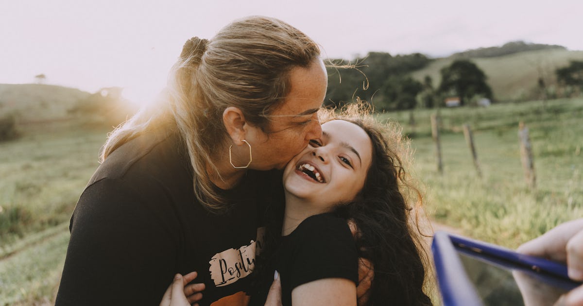 mother hugging daughter on.jpg