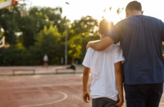 embraced father son walking.jpg