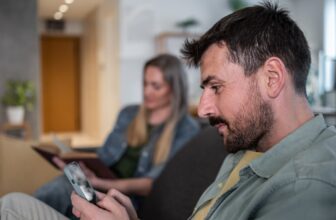 man using smartphone while.jpg