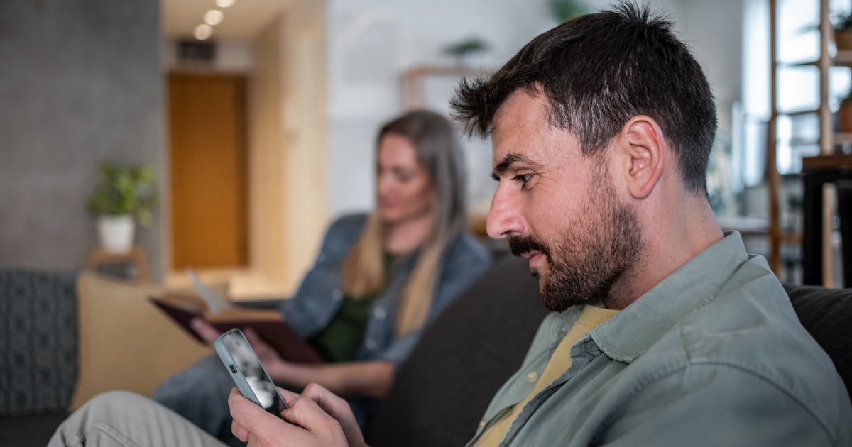man using smartphone while.jpg