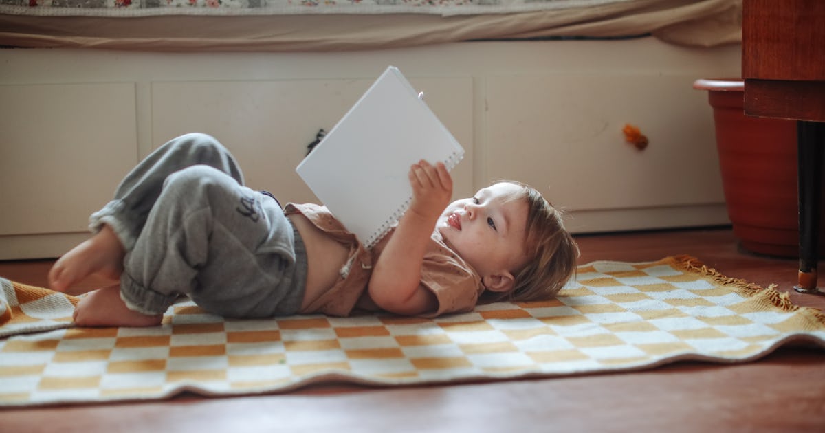 toddler lying on the.jpg